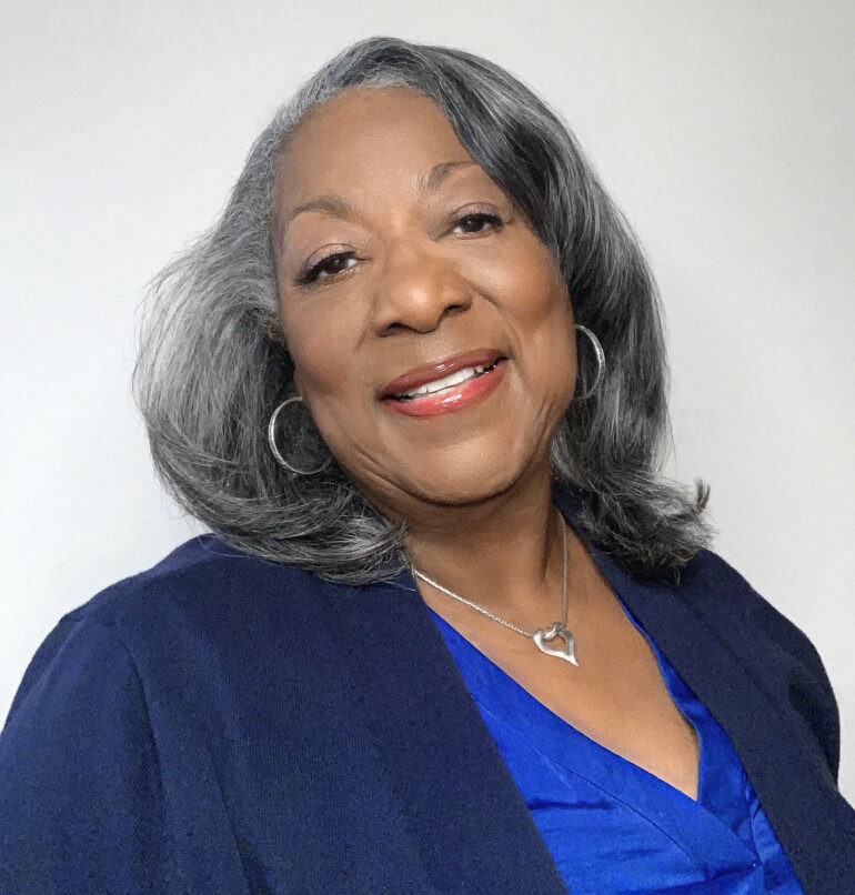 Headshot of Darlene Hines wearing a dress blue top with a cardigan.